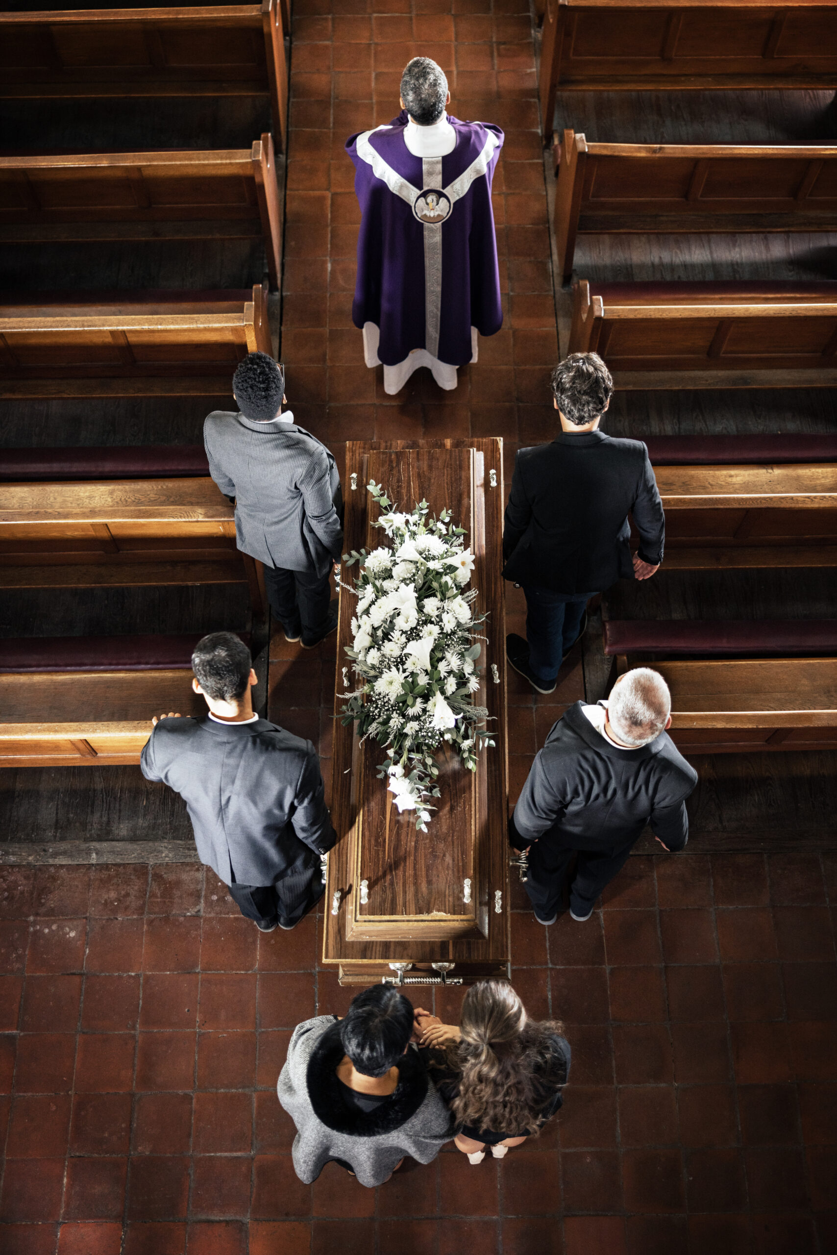 funeral-church-and-sad-people-carrying-coffin-wit-2025-04-06-09-12-35-utc